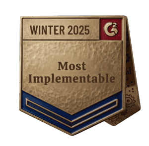 Gold and blue metallic badge or award emblem with embossed text reading “WINTER 2025” and “Most Implementable” featuring a red corner square with a stylized C² logo, isolated on a transparent background